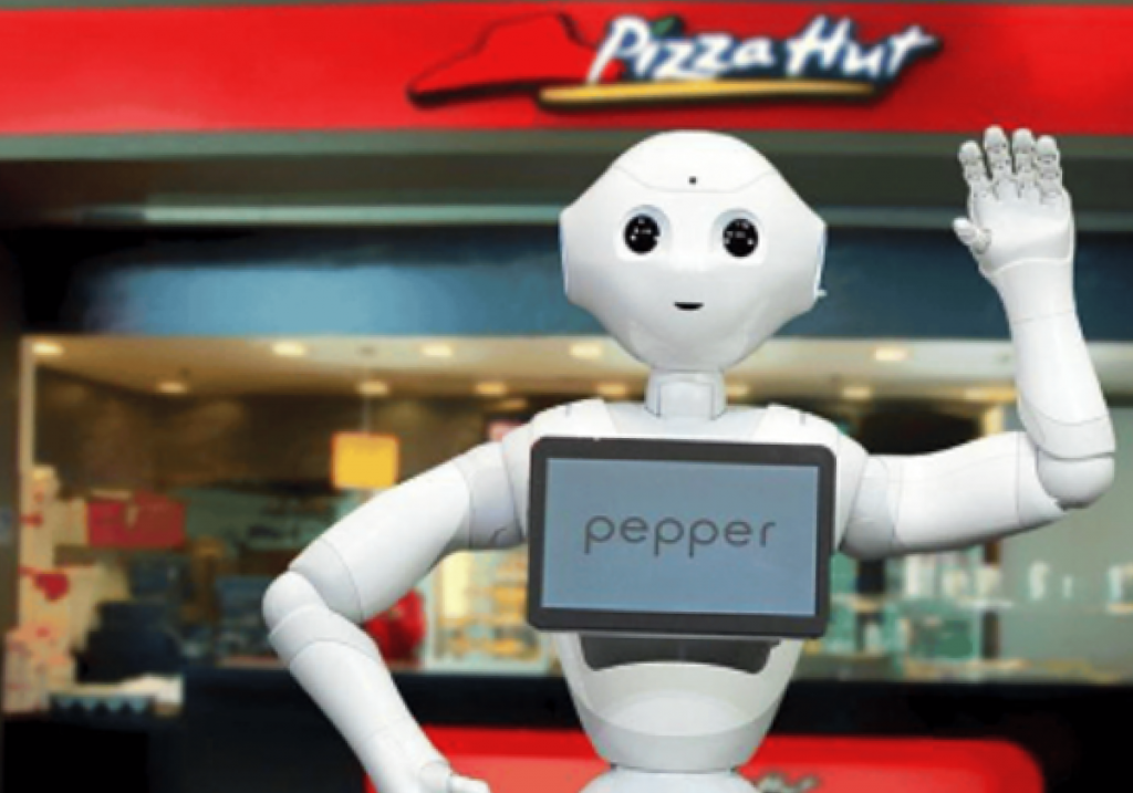 机器人在餐馆门口向往来行人招手以吸引食客前来就餐